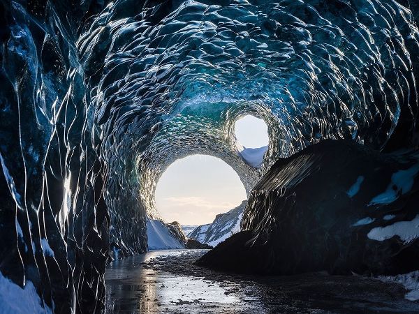 Ice cave at the northern shore of glacial lagoon Jokulsarlon in glacier Breidamerkurjokull
